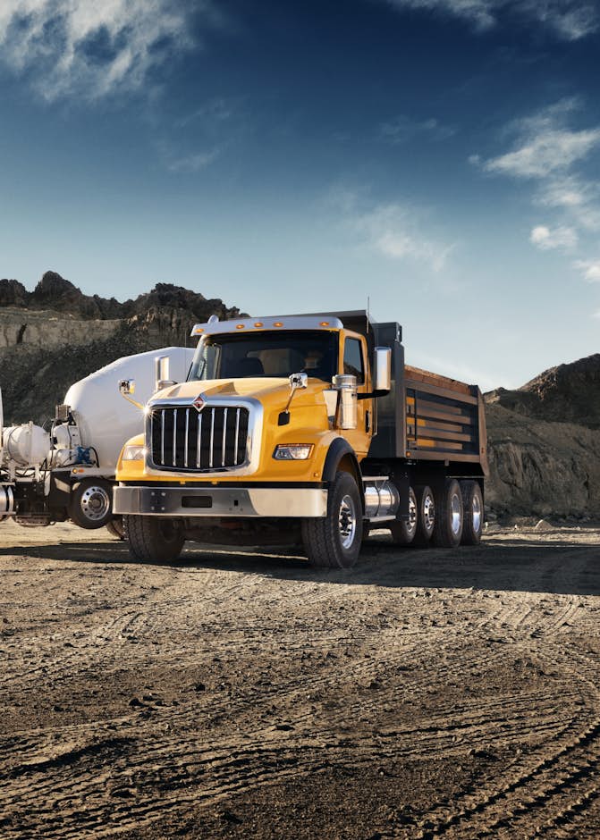 A large truck parked in a dirt area