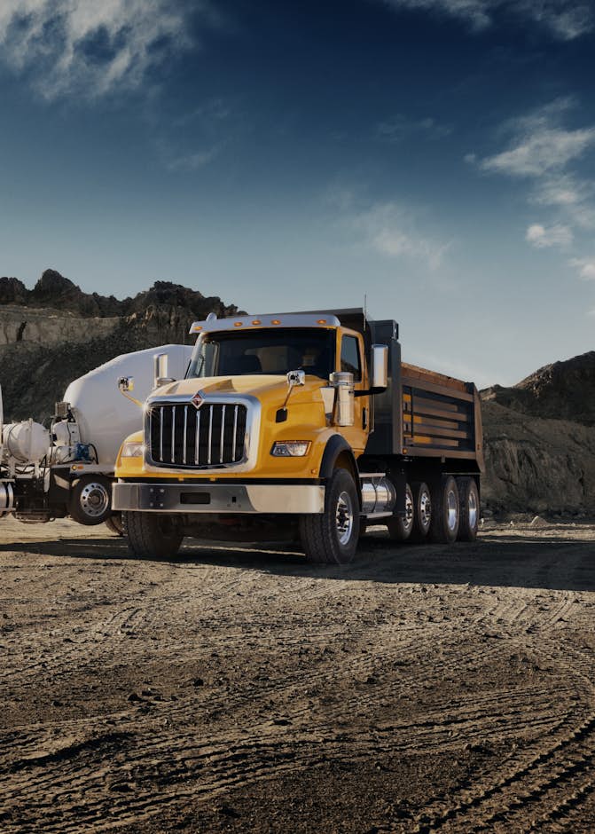 A large truck parked in a dirt area