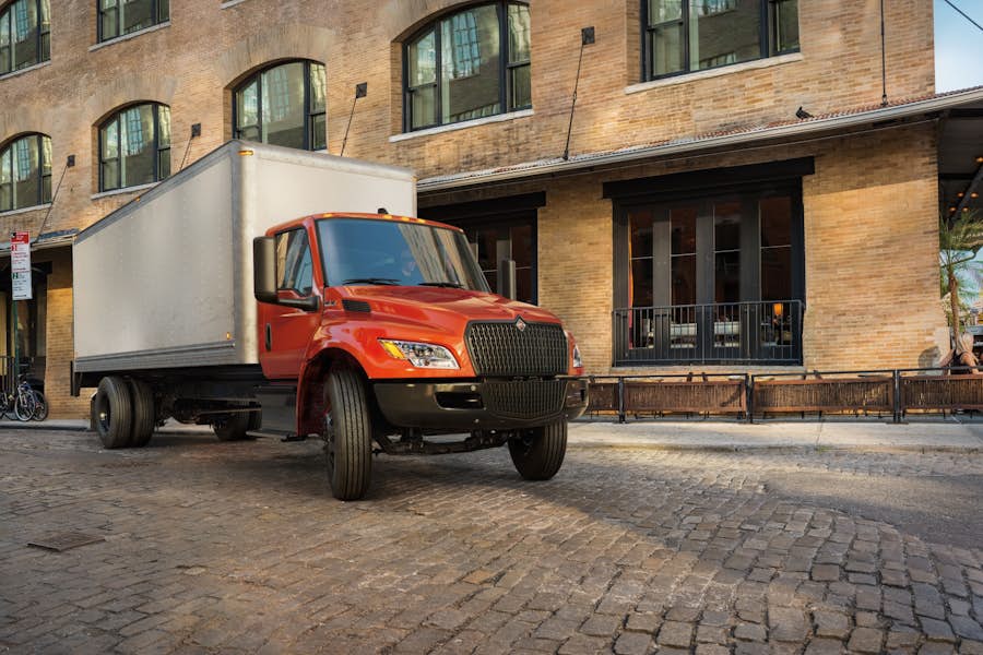 A truck parked in front of a building