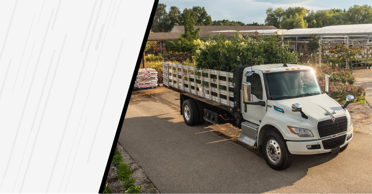 A person carrying pallets of materials