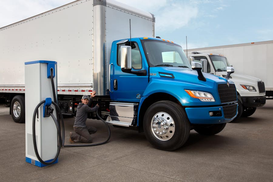 A person filling up a truck