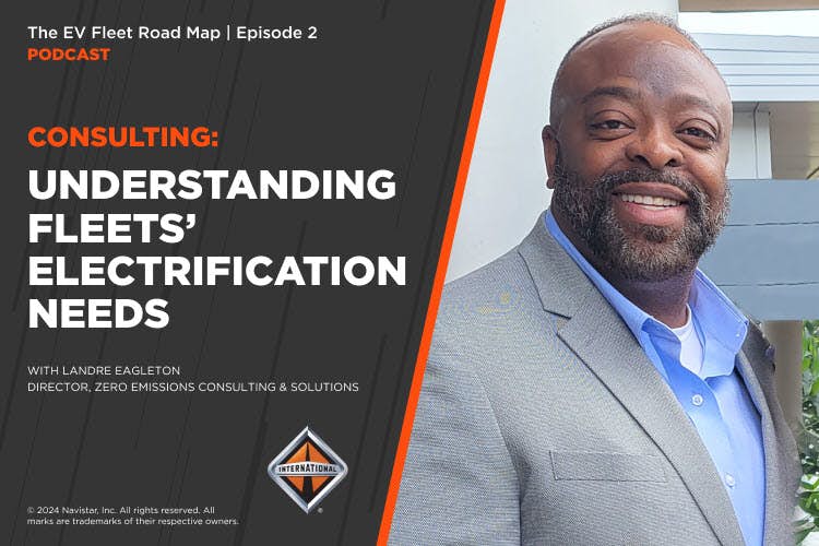 A person in a suit smiling