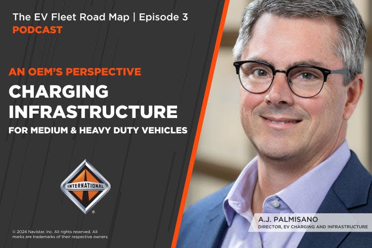 A person wearing glasses and a blue suit