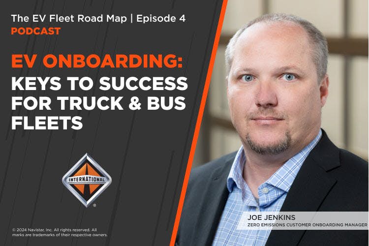 A person in a suit and a poster