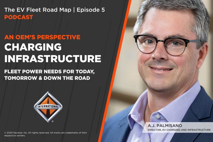 A person wearing glasses and a blue suit