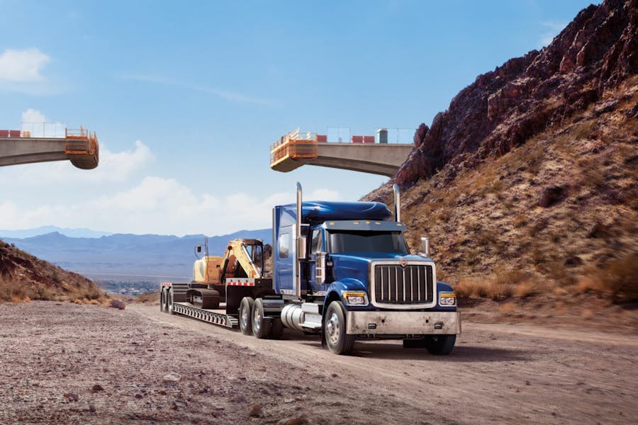 A truck on a road with a crane on it