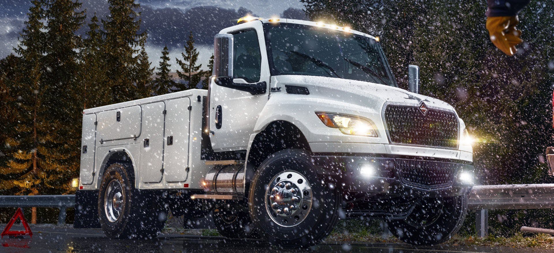 A white truck with lights on