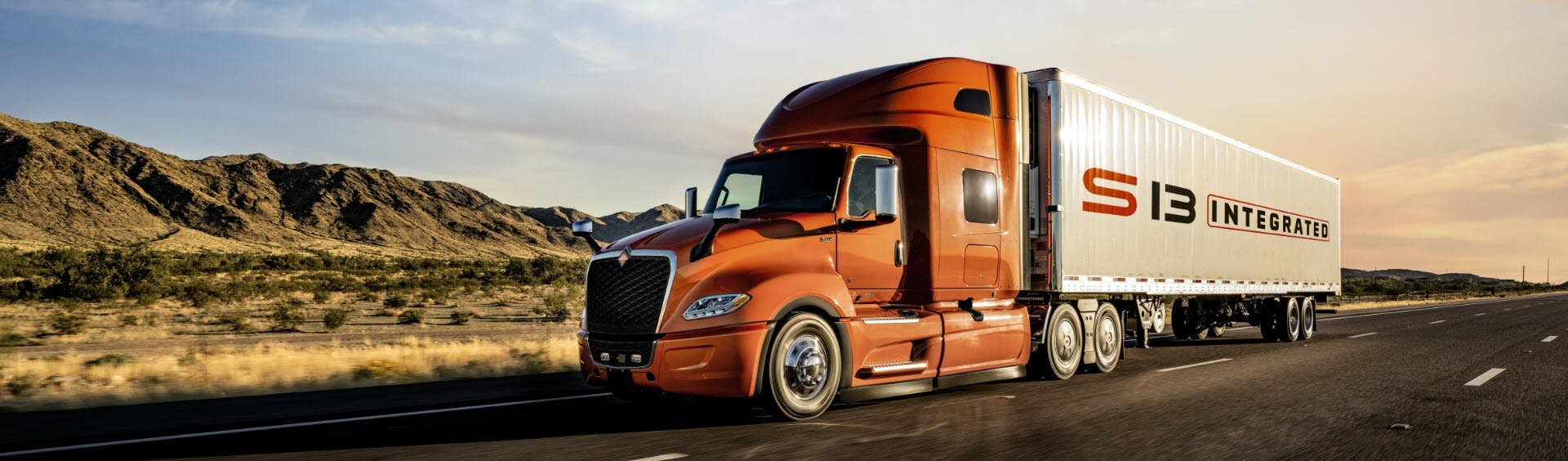 A orange truck on the road