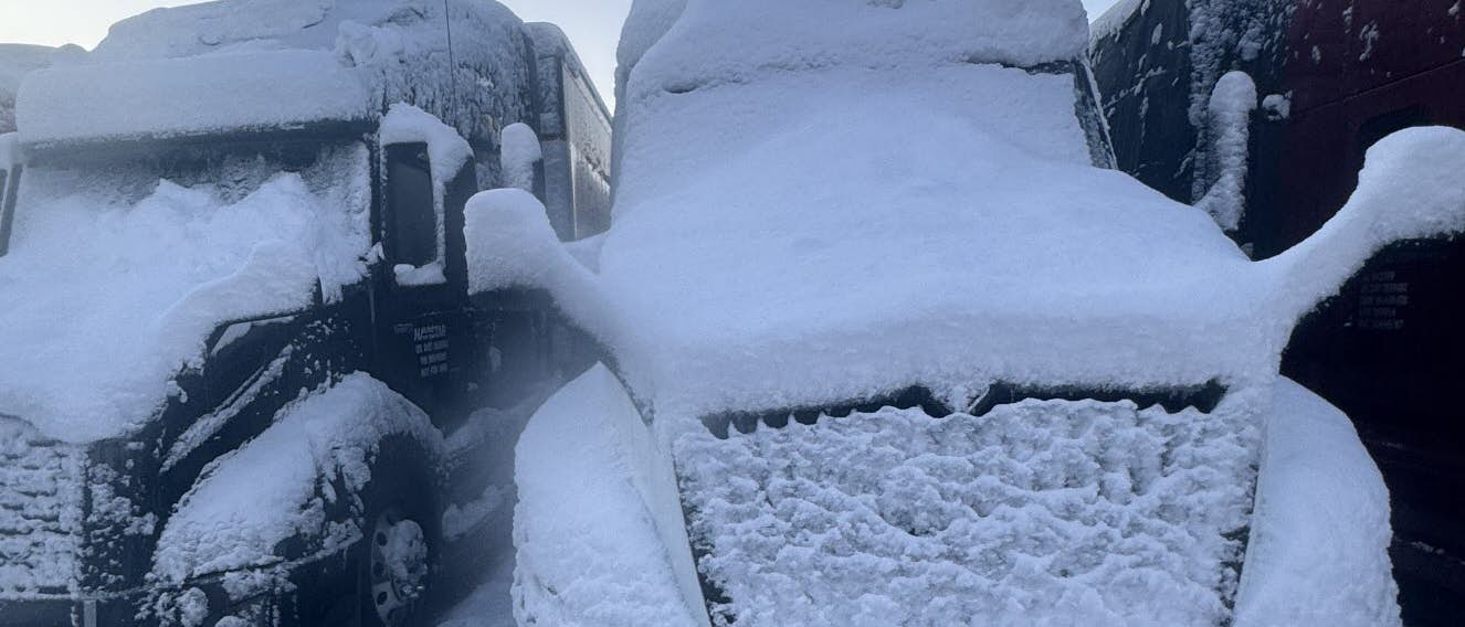 Truck covered in snow