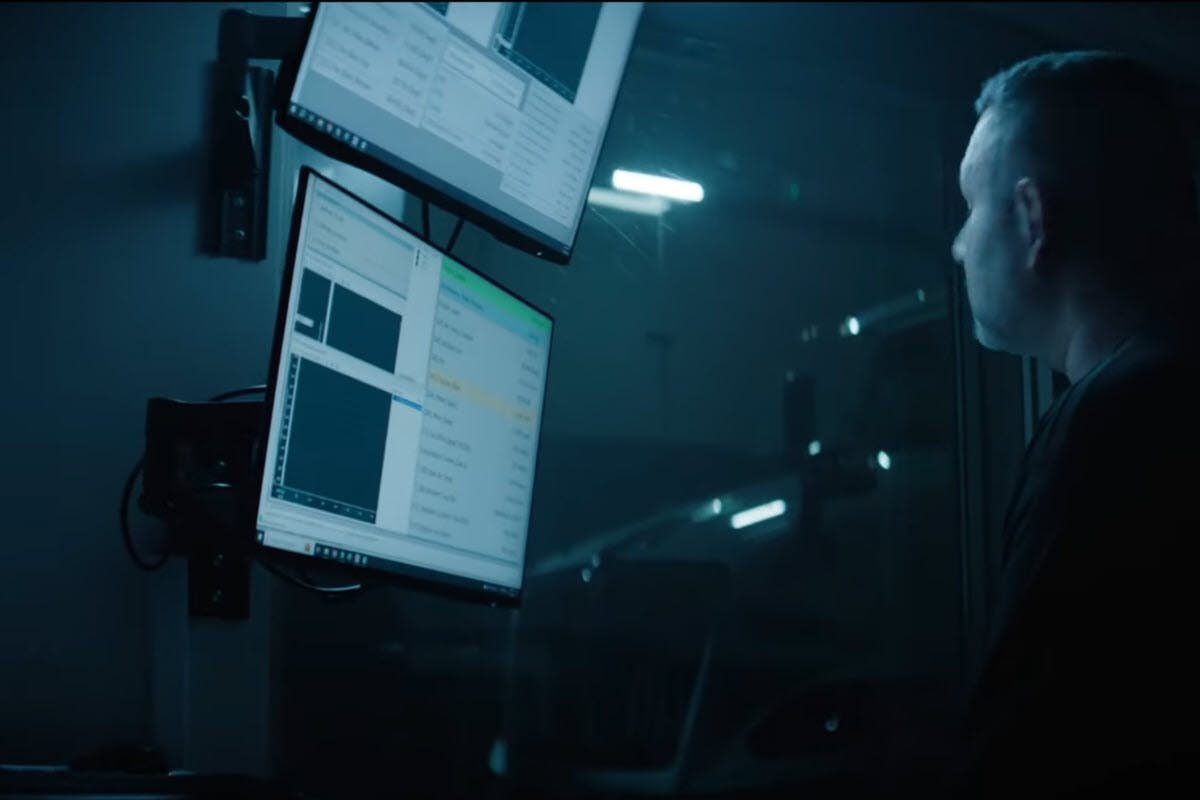 A person looking at a computer screen