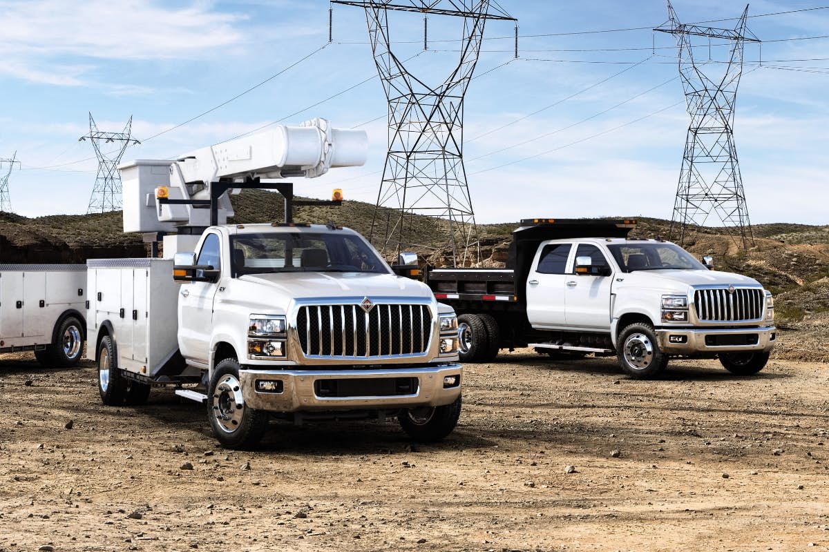 A truck with a crane on the side