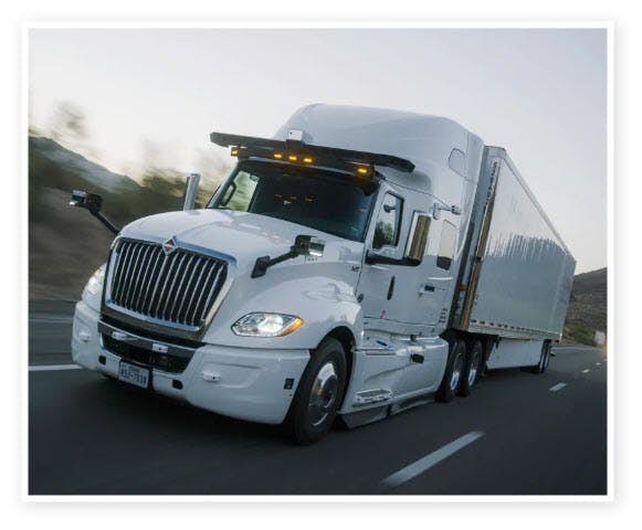 A white semi truck on the road