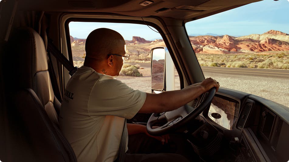 A person driving a truck