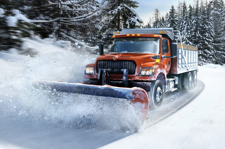 A truck plowing snow