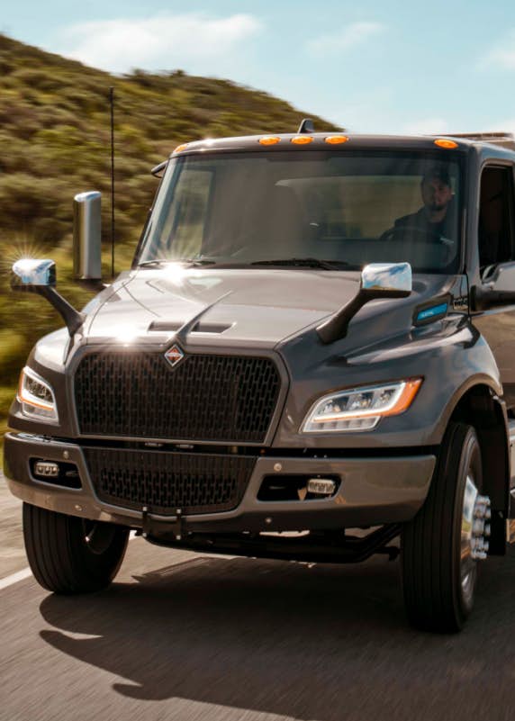A truck driving down the road