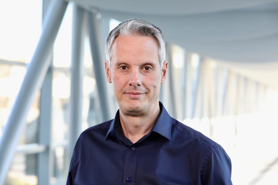 A person wearing a navy colored shirt