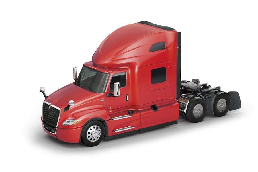 A red semi truck with a black trailer