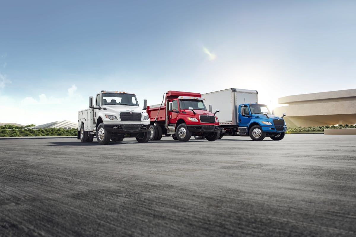 A group of trucks parked on a road