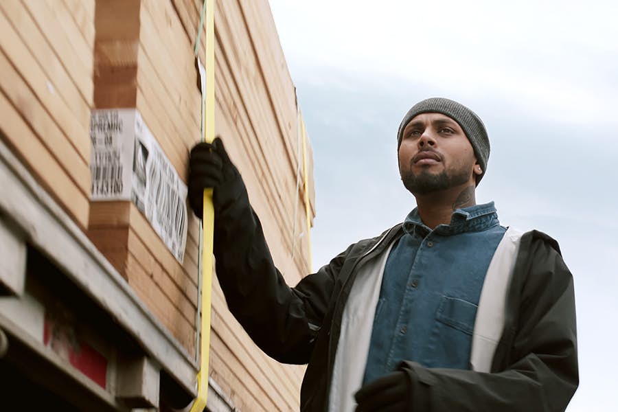 Person standing next to a truck