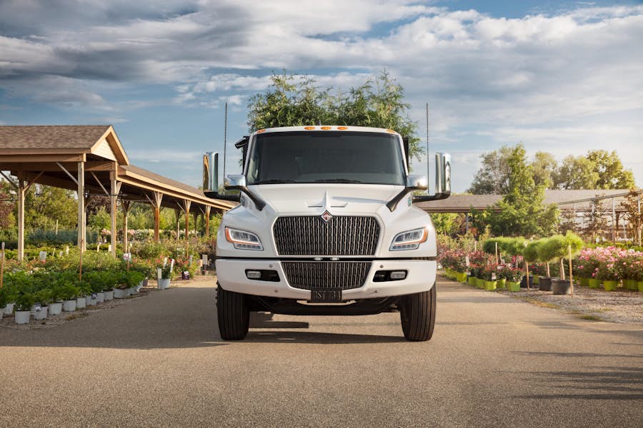 A white truck parked on a road