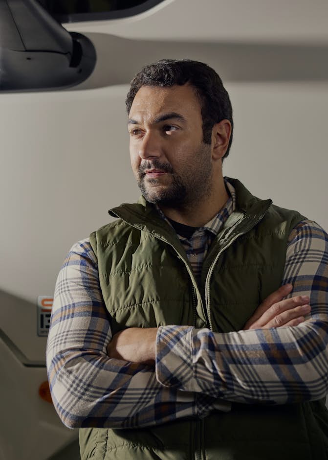 A person standing in front of a truck